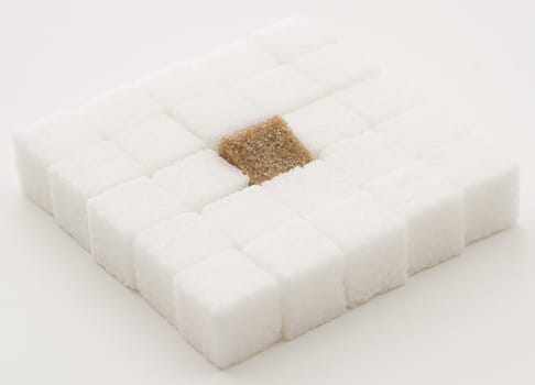  white sugar cube with one brown sugar cube place in a square shape