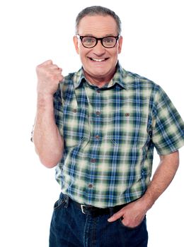 Excited elderly male dressed in casuals. Isolated over white