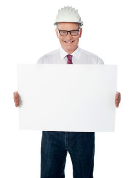 Businessman architect holding a blank white signboard. Senior