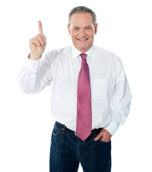 Smart businessperson pointing upwards  over a white background