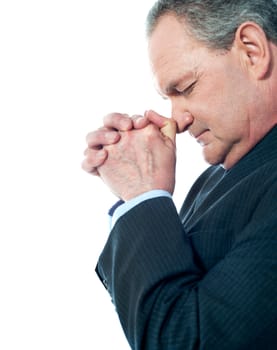 Portrait of matured businessman praying isolated on white background