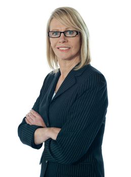 Senior female manager posing with arms crossed isolated over white