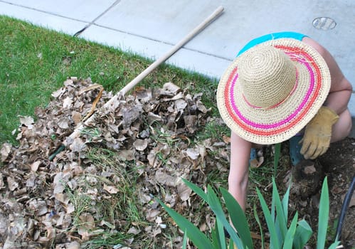 Mature female gardener working outside.