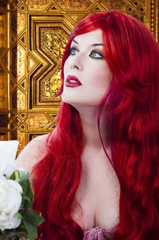 The beautiful young woman red haired in mysterious medieval room