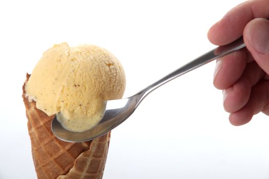 Studio closeup of vanilla ice cream cone