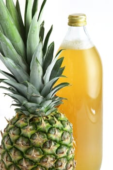 Pineapple and a bottle of juice