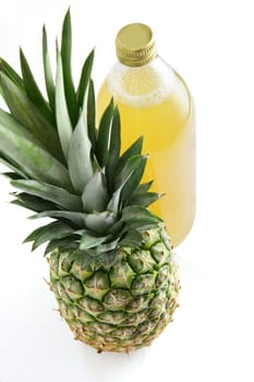 Pineapple next to pineapple juice