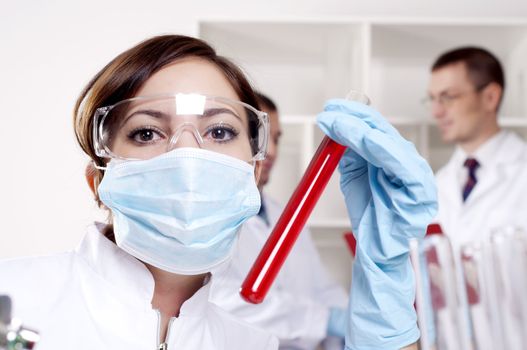 chemist working in the laboratory, mix liquid