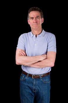Angry Frowning Grumpy Middle Age Man with Arms Folded Black Background