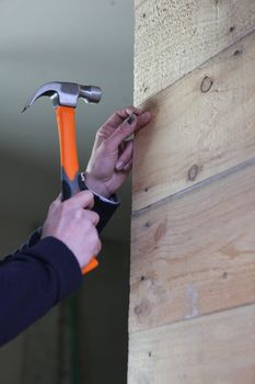 Handyman using a hammer