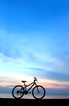 Silhouette of a Bike on the Beach