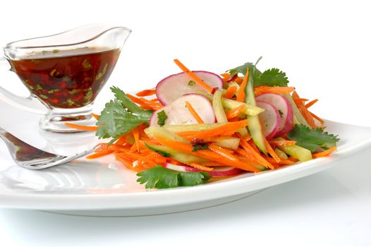 Salad of fresh carrots with the radish and cucumber