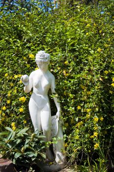 Sculpture of beautiful girl - muse taken in garden