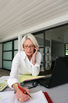 senior businesswoman working at home