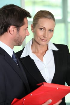 Businessman and woman smiling