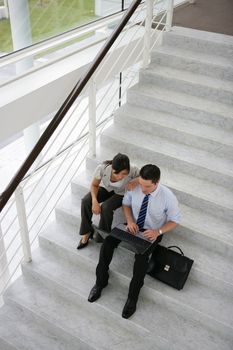 Business people on a stairwell