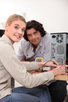 Woman assessing problem with computer