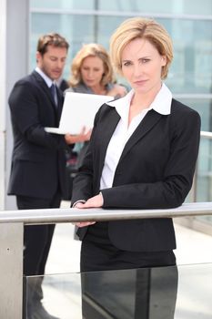 Serious executives outside office building