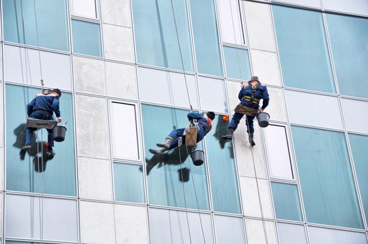 Window cleaner working on a glass facade
