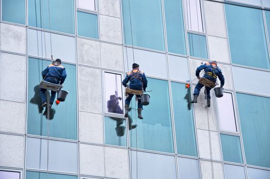 Window cleaner working on a glass facade