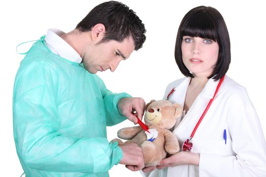 Doctor healing teddy bear