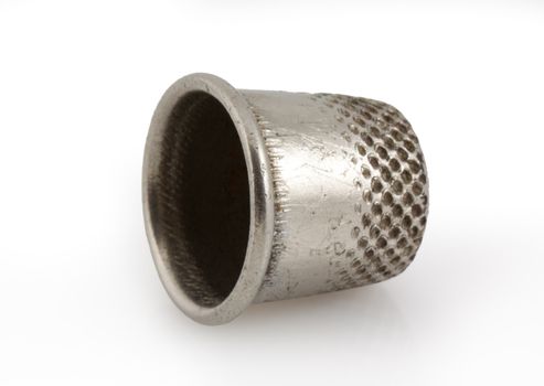 Silver thimble isolated on white background