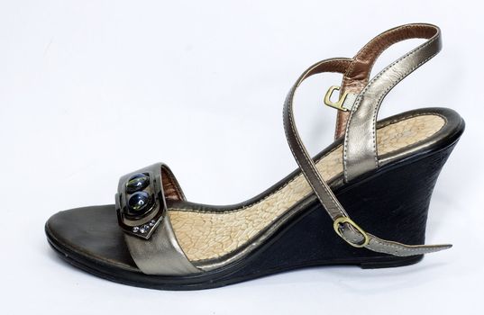 Beige-golden female new varnished shoes on high heel-stiletto 