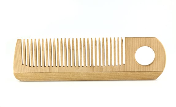 Wooden comb isolated on white background