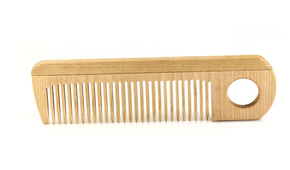 Wooden comb isolated on white background