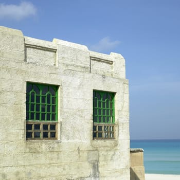 Old tropical villa made of stone blocks
