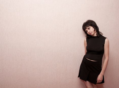 brunette girl on a pink background