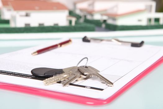 House keys resting on clip-board