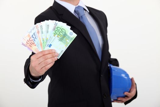 real estate businessman holding money in cash