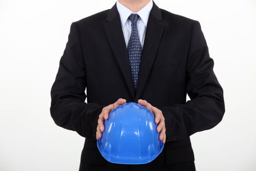 Architect holding his hard hat