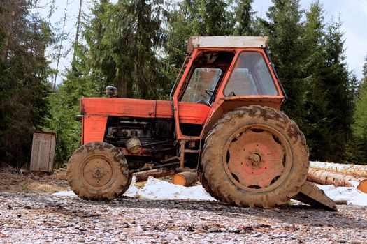 old tractor in the mountain woods used by saw dust eaters