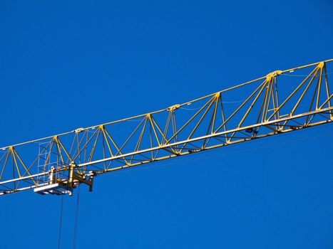 Detail of the jib of a yellow hoisting tower crane