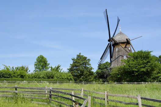 Traditional wooden wind mill in a museum in Denmark