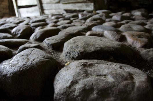 ancient paving made of cobblestones, cobbles or sett