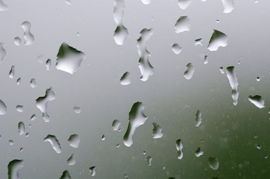 Closeup of water drops on a  window when it is raining outside