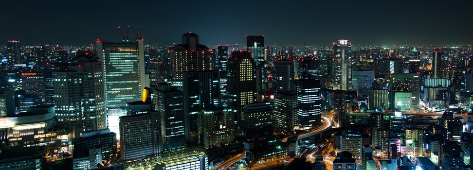 Panorama skyline of Osaka City in Japan at night with lots of lights