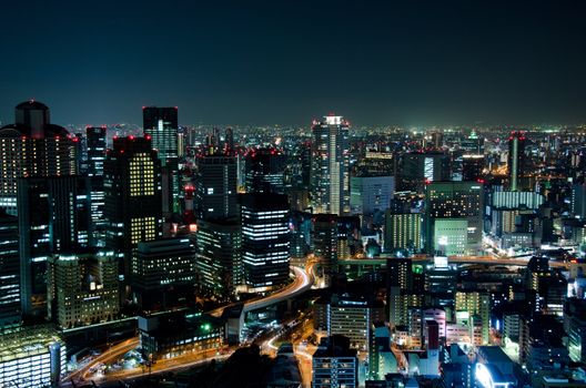 Skyline of Osaka City in Japan at night with lots of lights