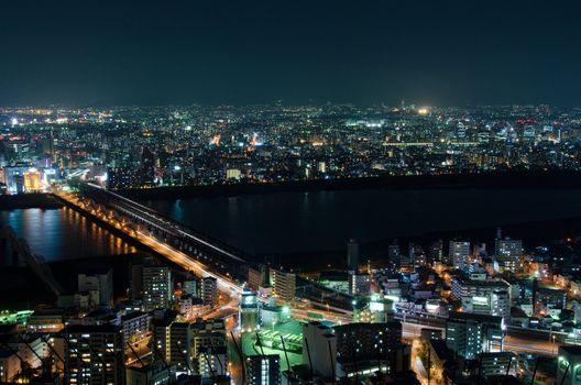 Skyline of Suita and Toyonaka City in Japan at night with lots of lights