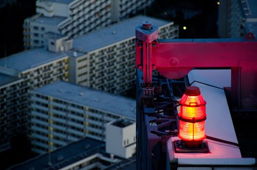 flashing red light for air traffic control at a skyscraper as seen from above