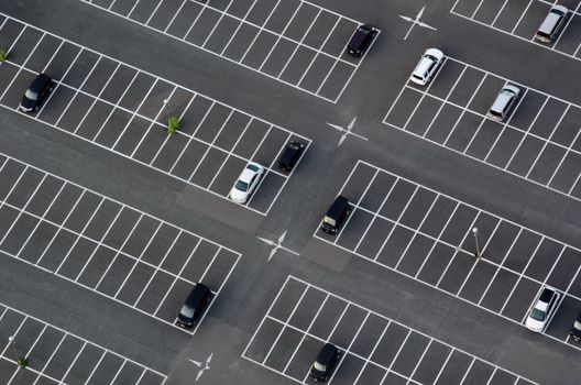 Car park seen from above with many empty parking lots