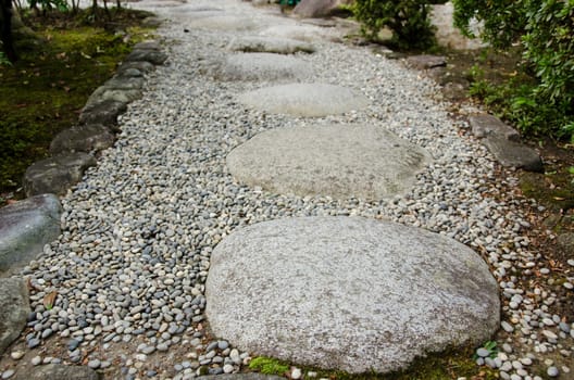 Stepping stones on gravel in a japanese garden