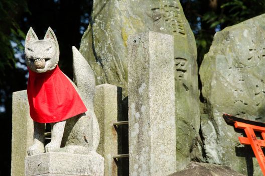 Fox statue at the Fushimi Inari taisha Shrine in Kyoto Japan