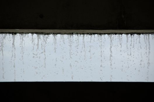 Curtain of water seen from inside a building