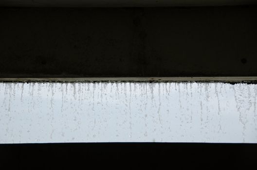 Curtain of water seen from inside a building