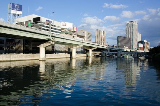 Water, Skyscrapers and highway in Osaka, Japan