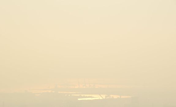 The harbor of Osaka on a foggy and sunny day